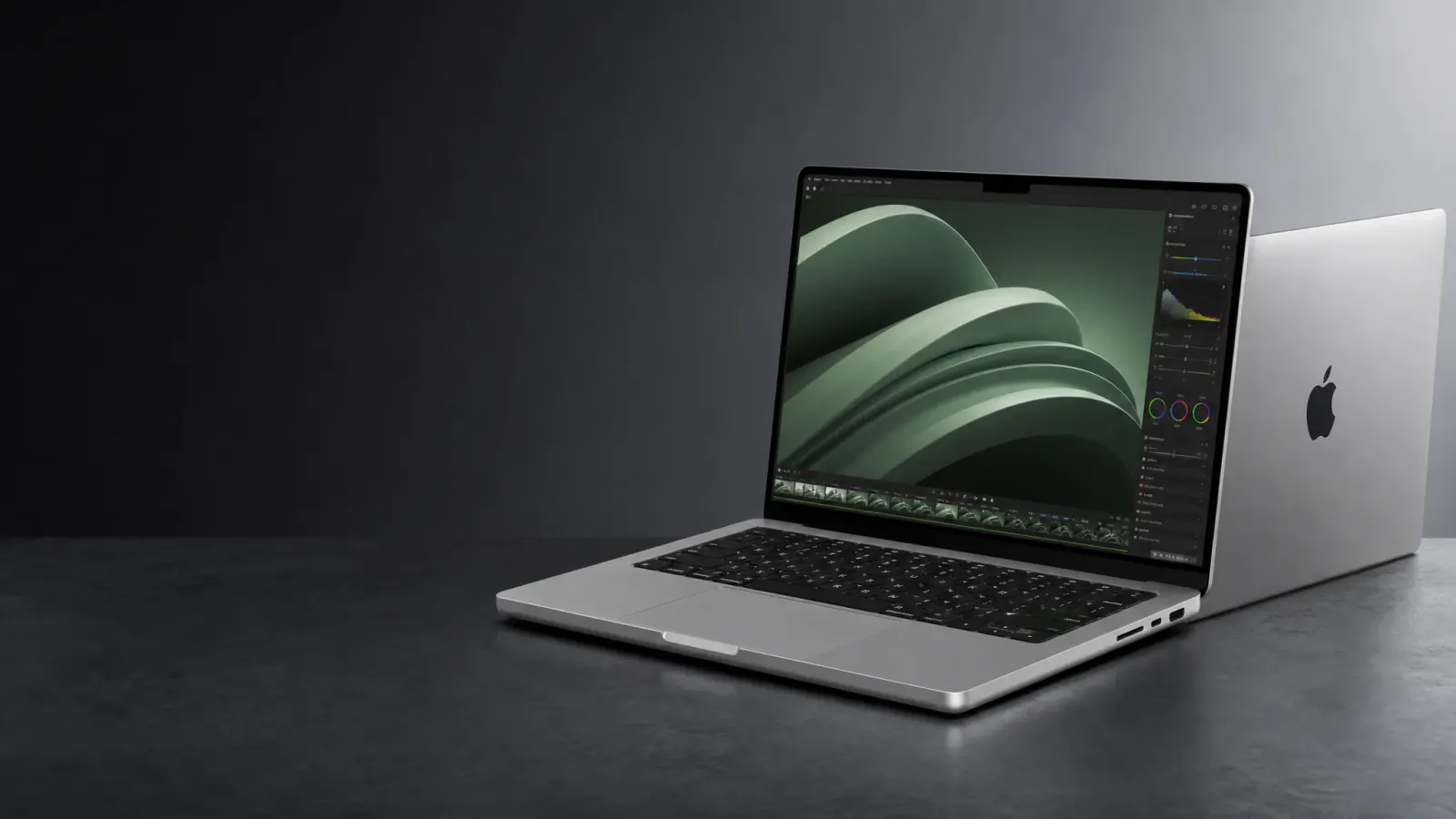 Apple MacBook Pro in a wide dark storefront composition with open copy space.