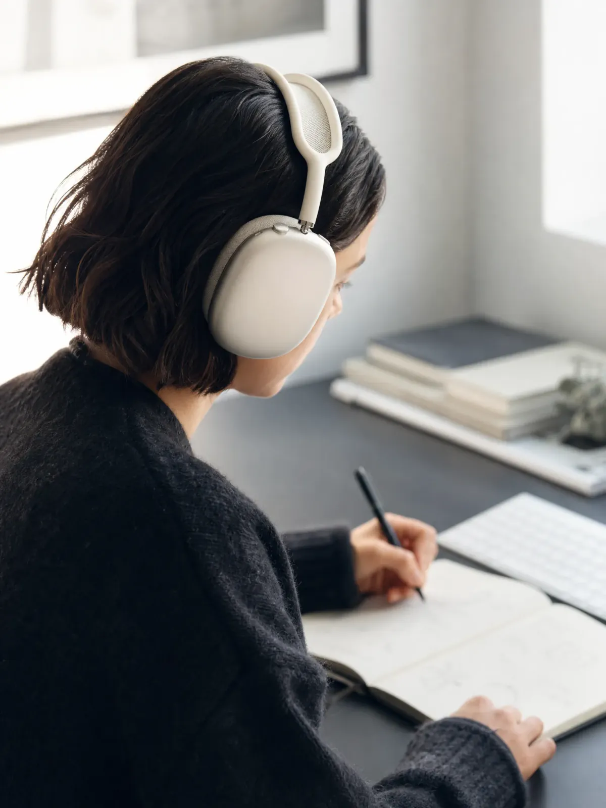 Apple AirPods Max worn during a focused daylight work session.