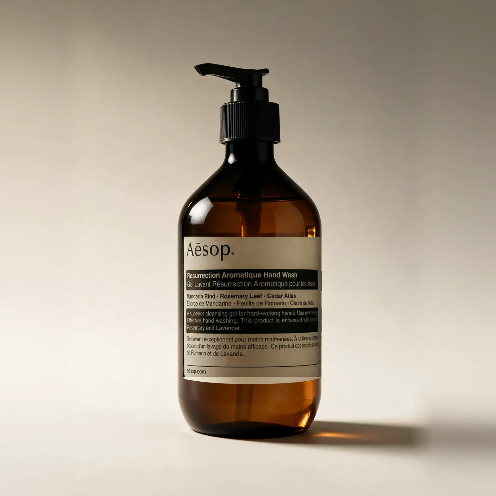 A square catalog packshot with even spacing around a pump bottle.