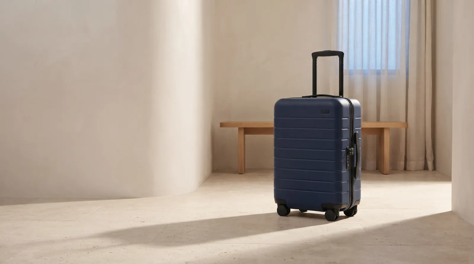 A wide storefront image with a suitcase focal point and open space for store copy.